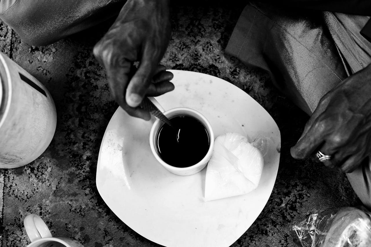 Black and white image of a traditional tea being prepared in Abuja, Nigeria.