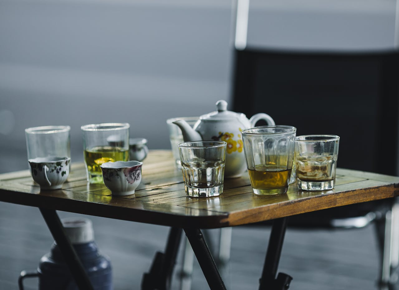 A cozy arrangement of a Vietnamese tea set on a wooden table, perfect for intimate gatherings.